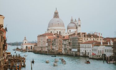 Beautiful Venice Grand Canal view with Basilica di Santa Maria della Salute in daylight, perfect for travel and architecture theme.