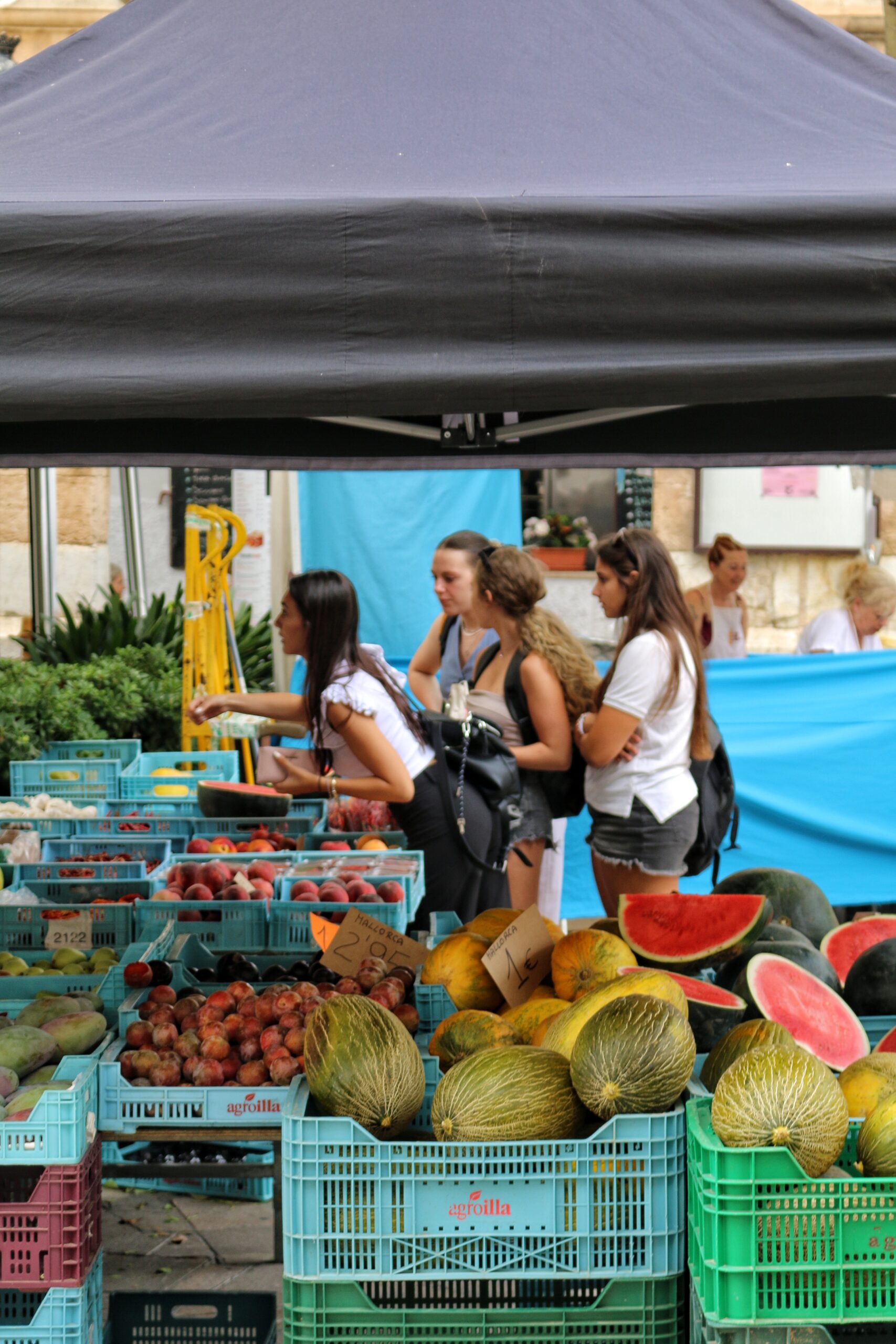 people buying fruit at market scaled.jpg